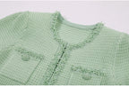 Pocket and neckline pearl embellishment detail on mint green dress