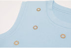 Side view accentuating ribbed knit and crystals on blue tank top