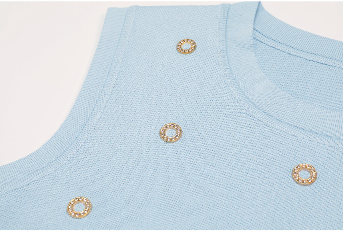 Side view accentuating ribbed knit and crystals on blue tank top