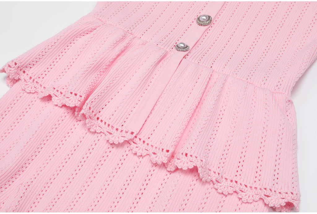 Pink peplum waist and lace trim detail of dress