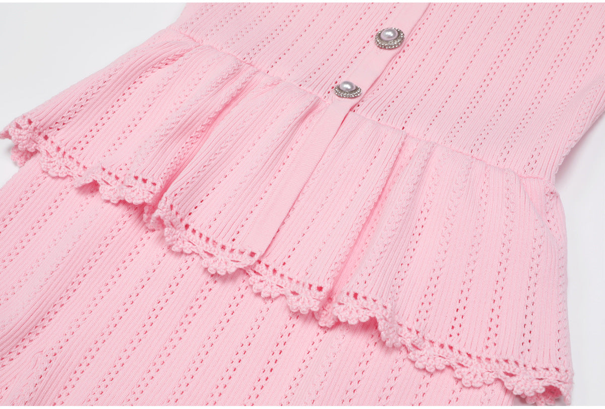 Pink peplum waist and lace trim detail of dress