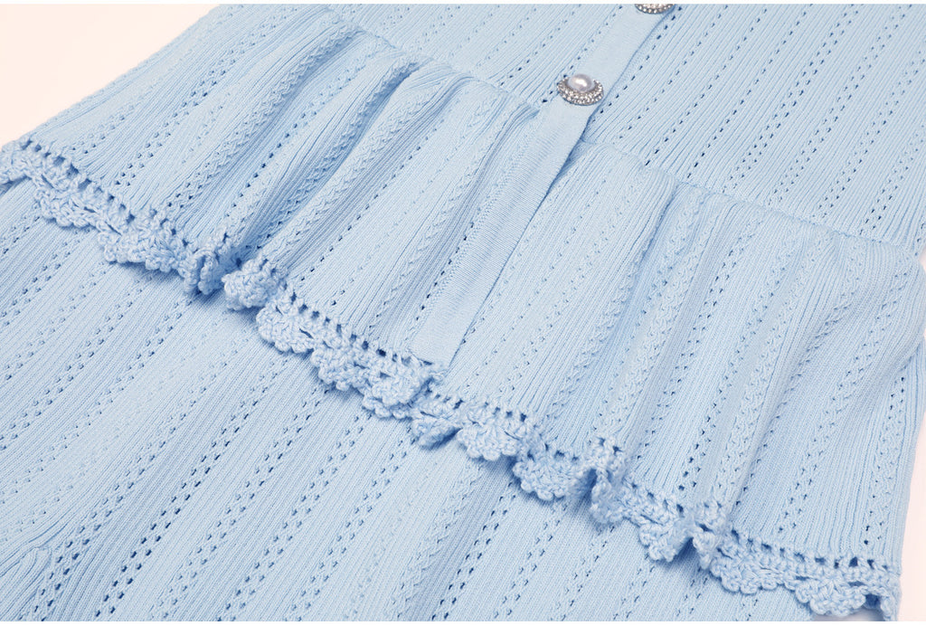 Blue peplum waist and lace trim detail of dress