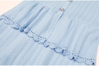 Blue peplum waist and lace trim detail of dress