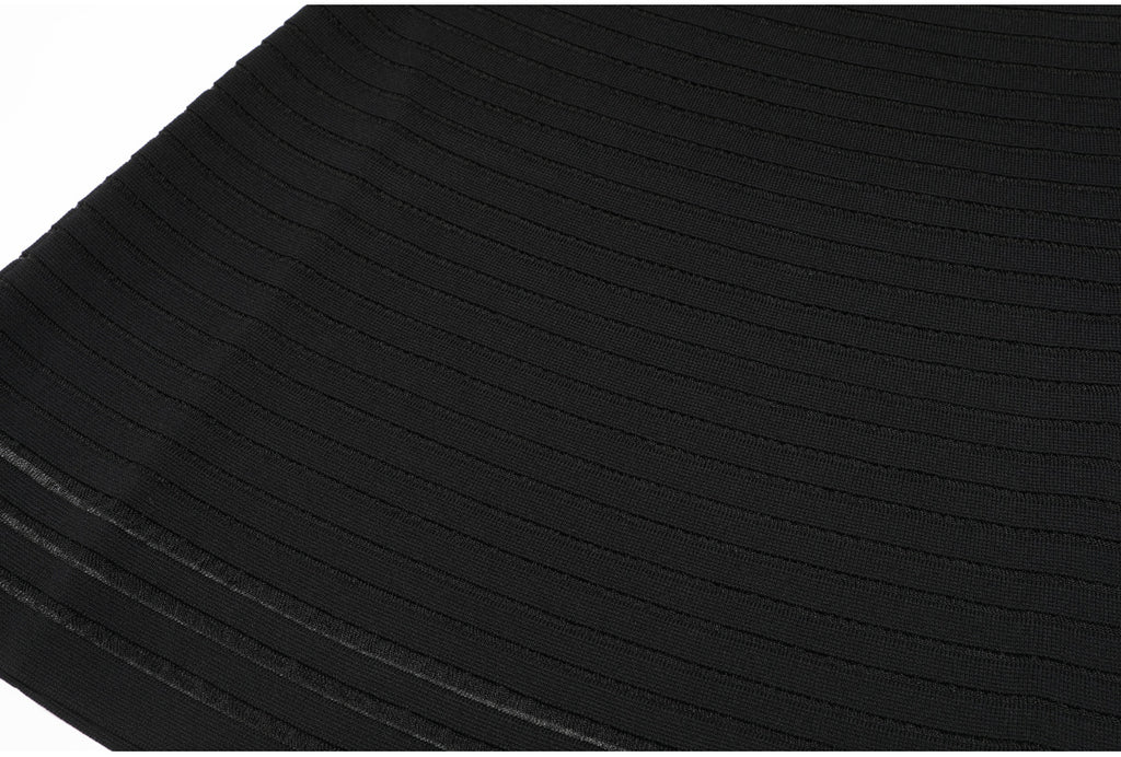 Close-up of black knit fabric with horizontal stripes