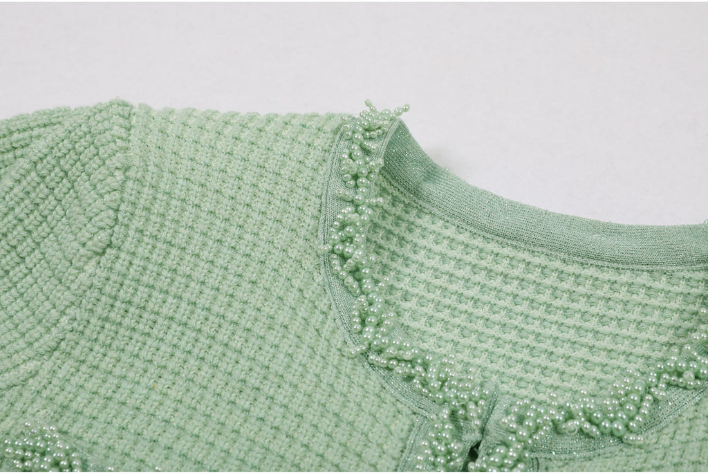 Front placket pearl embellishment and pockets on mint green dress
