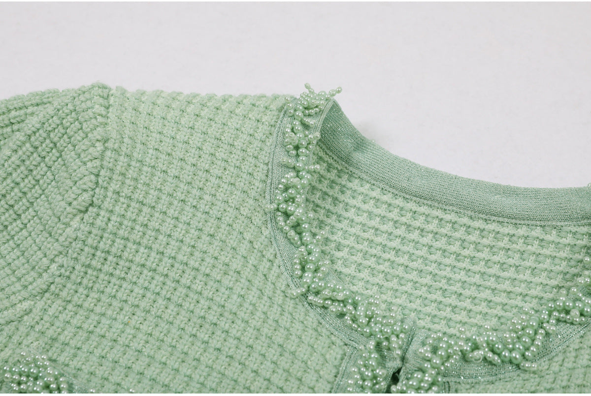 Front placket pearl embellishment and pockets on mint green dress