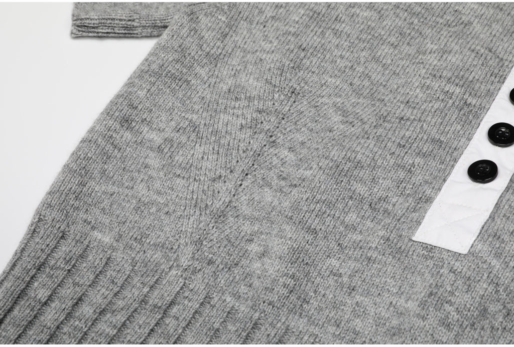 Side view of gray knit top with button placket