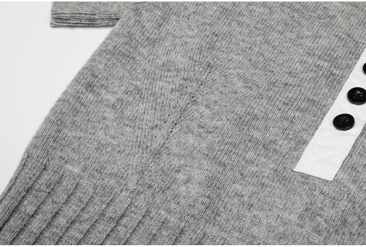 Side view of gray knit top with button placket