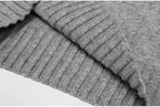 Folded ribbed edge of gray knit sweater