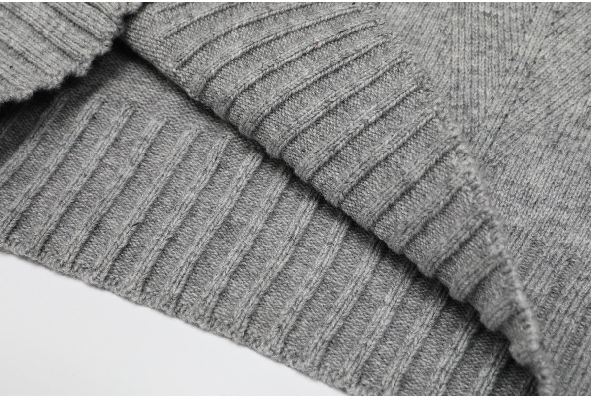 Folded ribbed edge of gray knit sweater