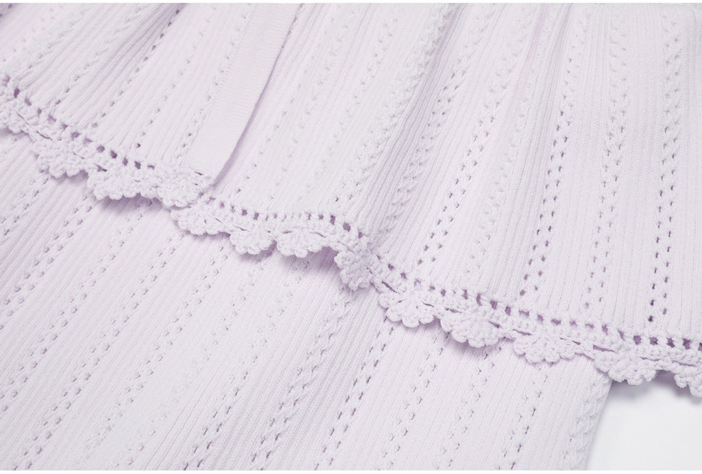 Lilac peplum waist and lace trim detail of dress