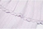 Lilac peplum waist and lace trim detail of dress