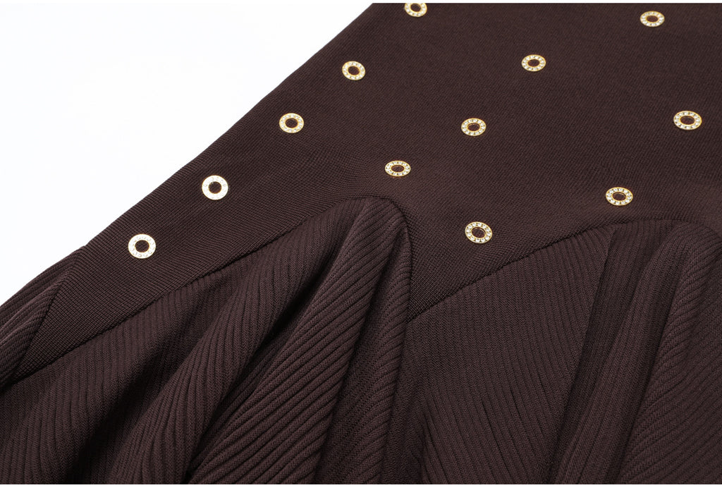Detailed ruffled brown skirt section with gold embellishments