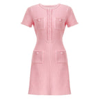 Front view of pastel pink textured knit dress with pockets