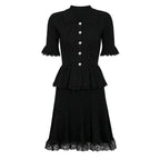 Black knit peplum midi dress with lace hem and pearl buttons