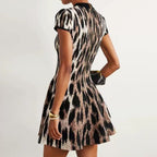 Back view of model in jacquard knit dress showing silhouette
