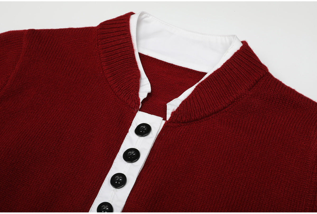 Close-up of wine red knit top with white button placket