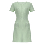 Front view of mint green textured knit dress with pockets