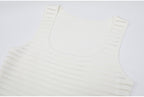 Close-up neckline of white striped knit dress