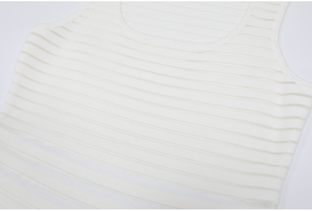 Upper bodice detail of white striped knit dress