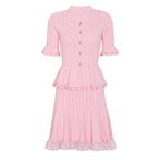 Pink knit peplum midi dress with lace hem and pearl buttons