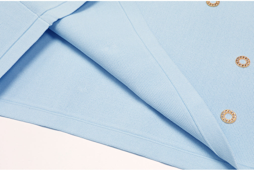 Close-up of blue knit fabric texture and finished edge