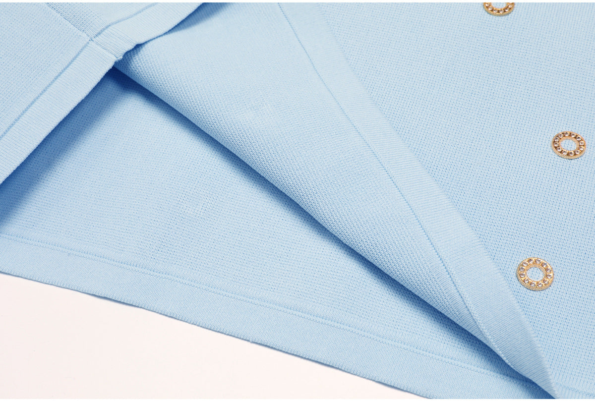 Close-up of blue knit fabric texture and finished edge