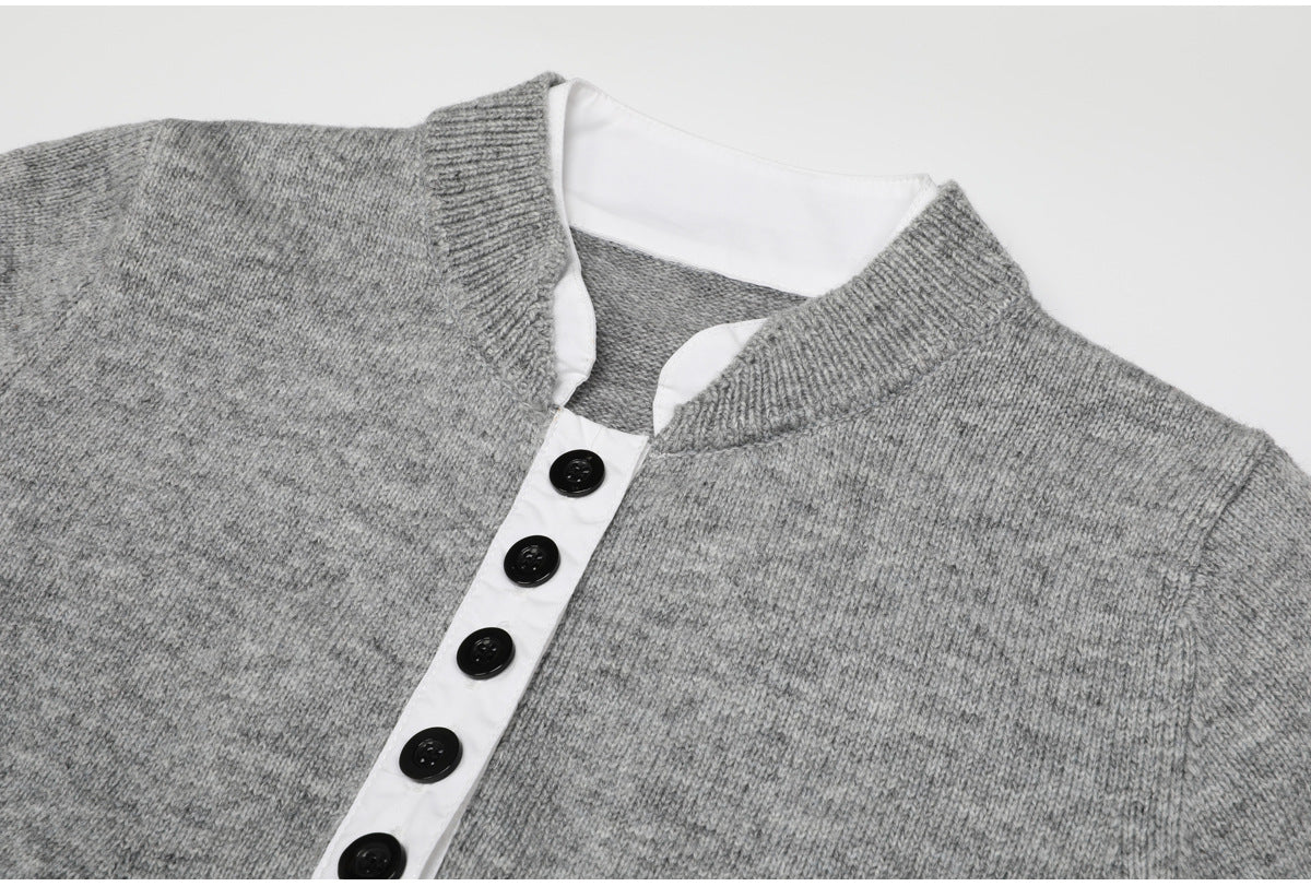 Close-up of gray knit top with white button placket