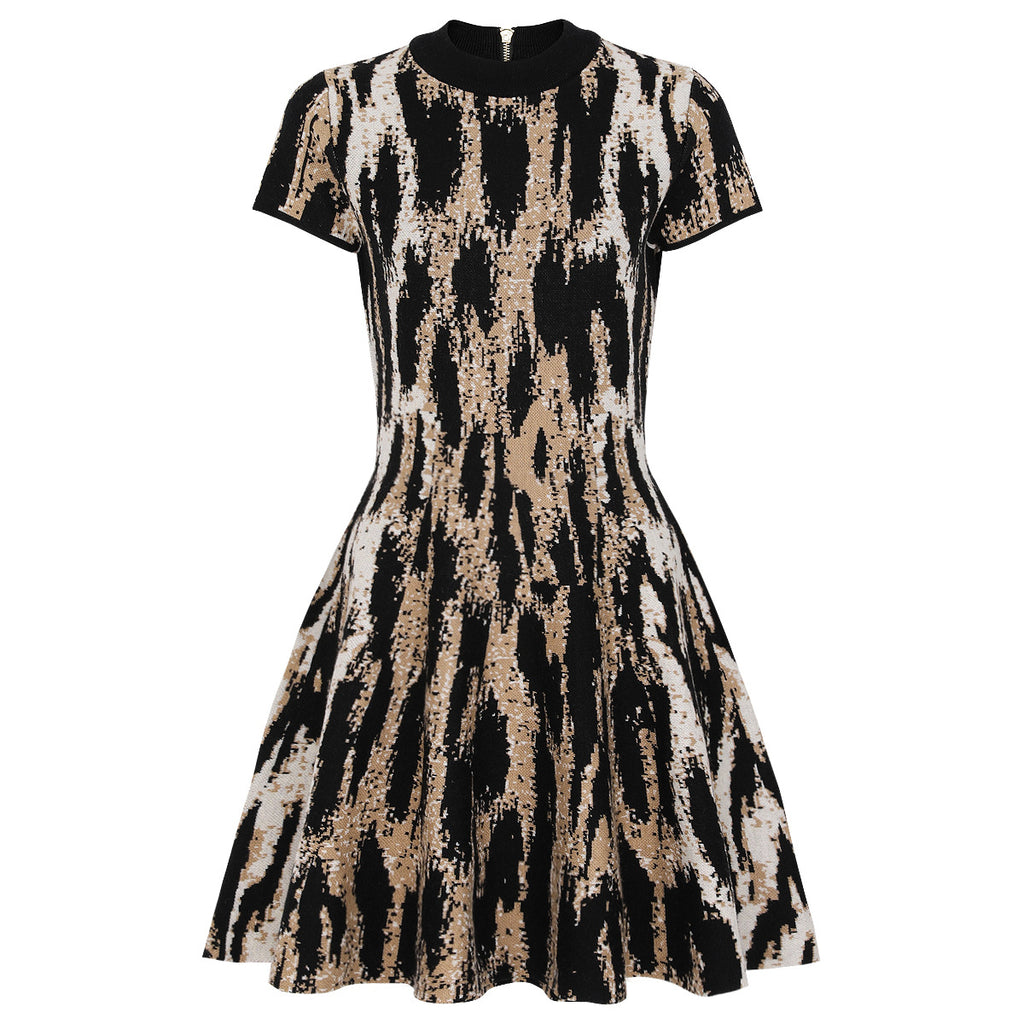 Flat lay of black and beige jacquard knit dress