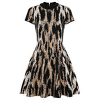 Flat lay of black and beige jacquard knit dress