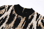 Detail of ribbed neckline and zipper on jacquard knit dress