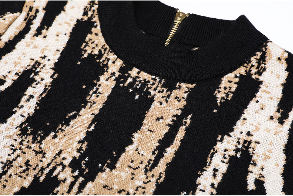 Detailed view of knit pattern and neckline with zipper