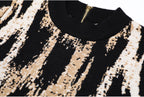Detailed view of knit pattern and neckline with zipper