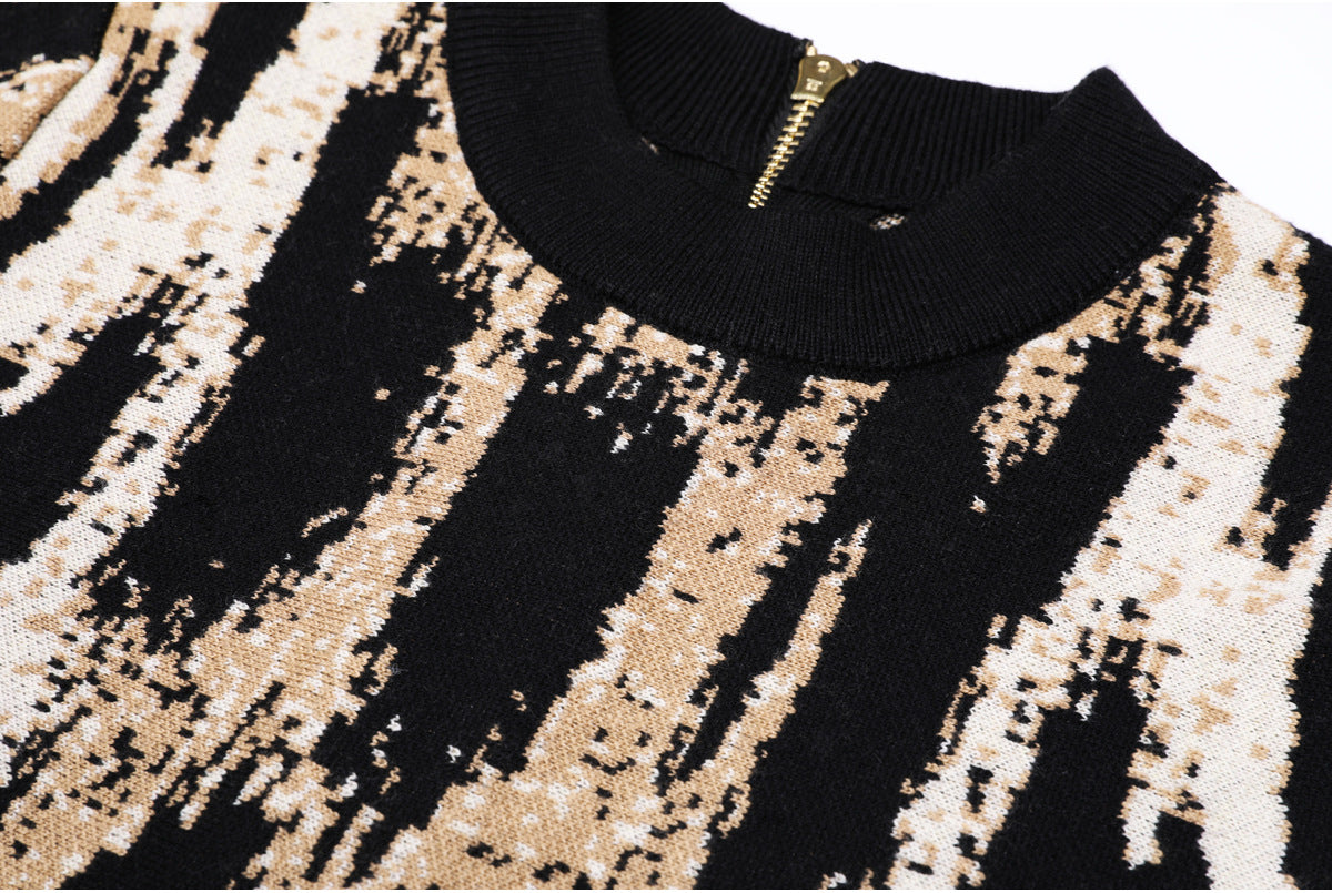 Detailed view of knit pattern and neckline with zipper
