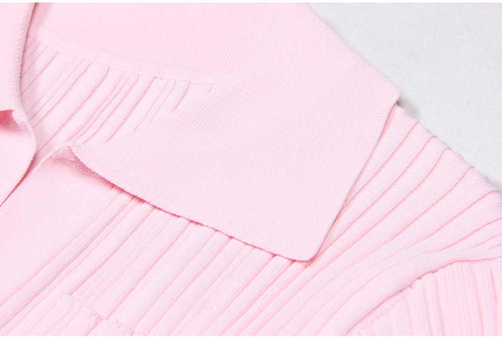 Detailed view of pink dress collar and ribbed fabric