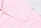 Detailed view of pink dress collar and ribbed fabric