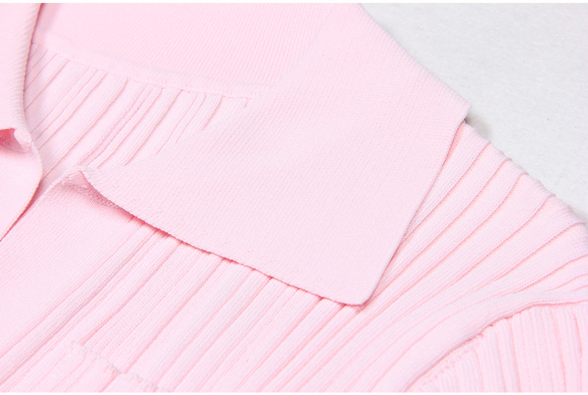 Detailed view of pink dress collar and ribbed fabric