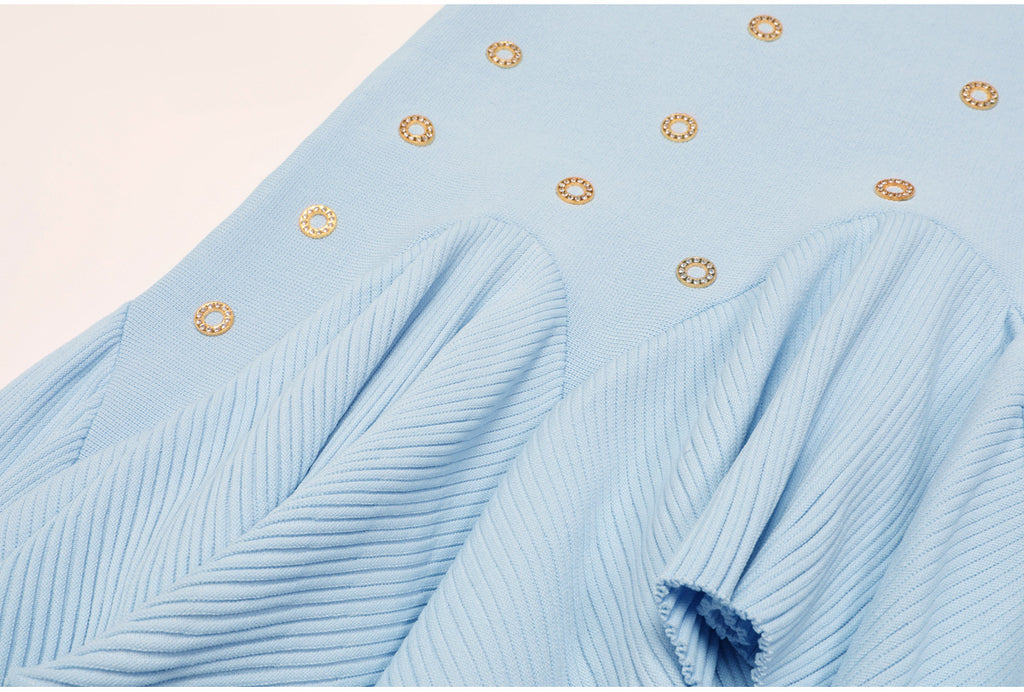 Another close-up on pleated ruffle area and embellishments of blue skirt