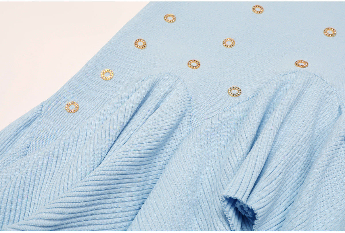 Another close-up on pleated ruffle area and embellishments of blue skirt