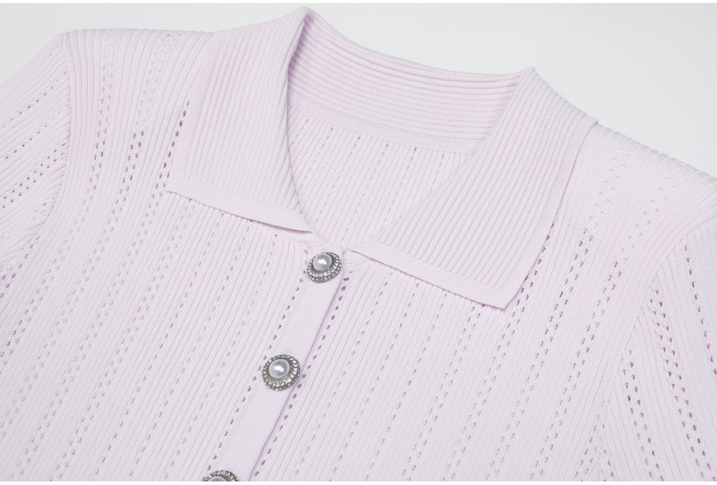 Close-up of lilac ribbed collar and pearl buttons on dress