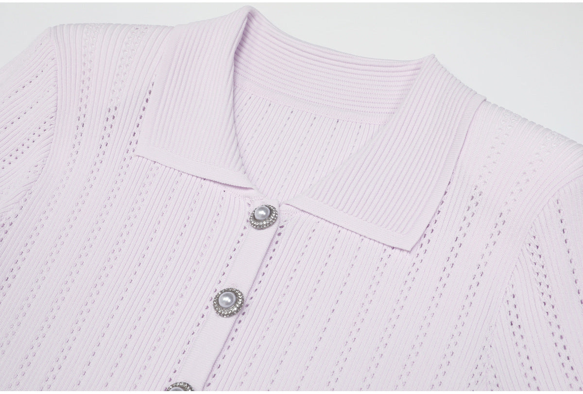 Close-up of lilac ribbed collar and pearl buttons on dress