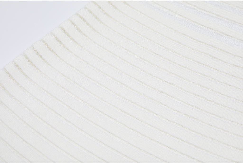 Close-up of white knit fabric with horizontal stripes