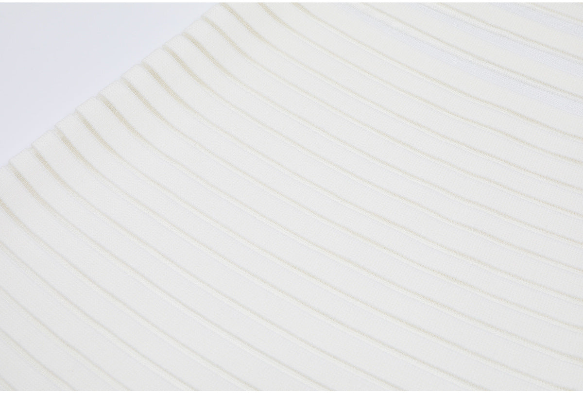 Close-up of white knit fabric with horizontal stripes