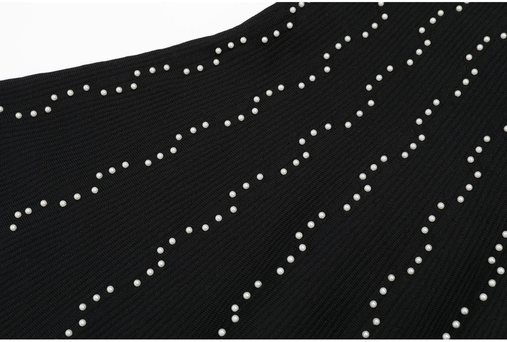 Bottom skirt section of black knit dress with pearl accents