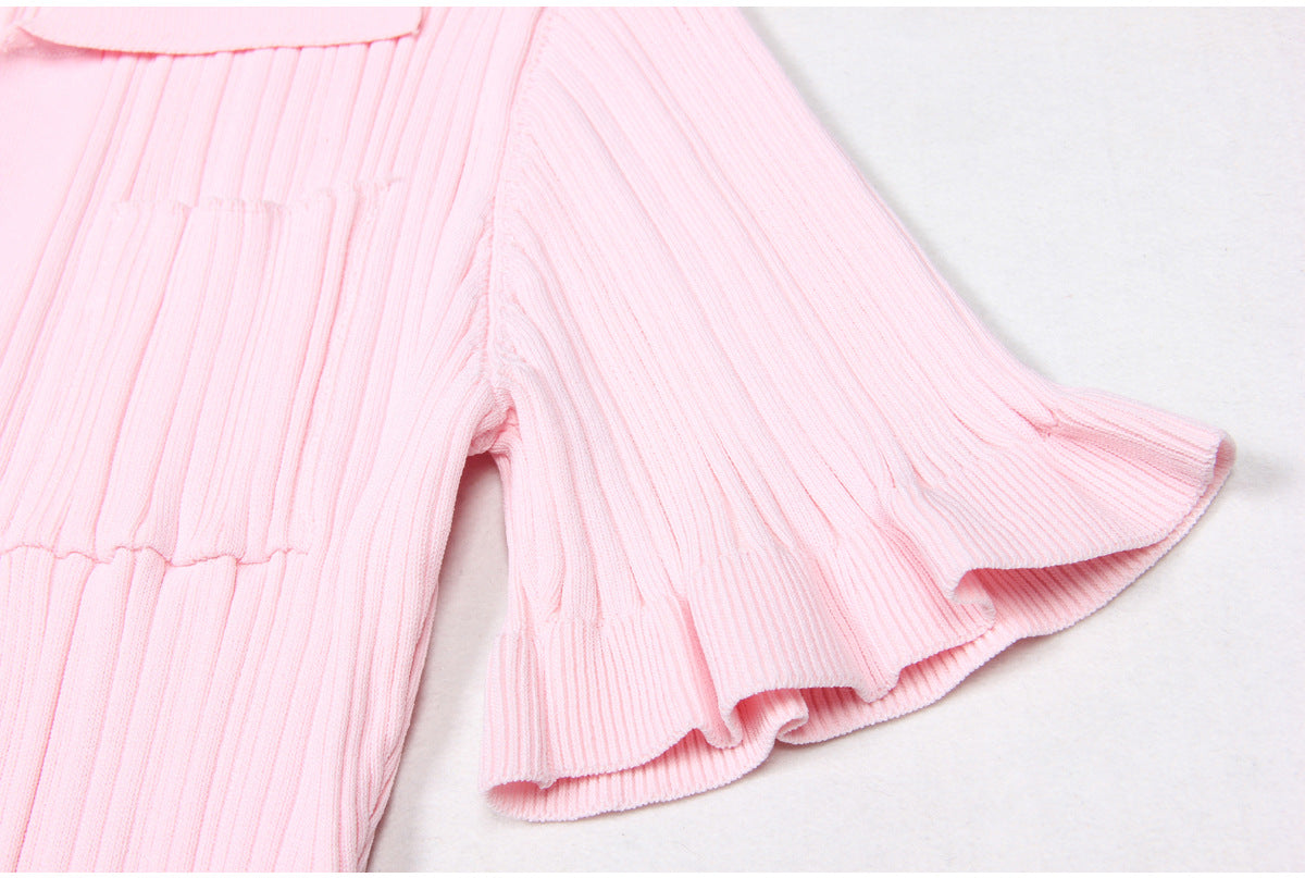 Close-up of ruffled short sleeve on pink dress