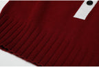 Ribbed hem detail on wine red knit top