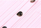 Macro of metallic button on pink dress
