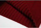 Folded ribbed edge on wine red knit sweater