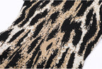 Fabric close-up showing abstract jacquard knit pattern
