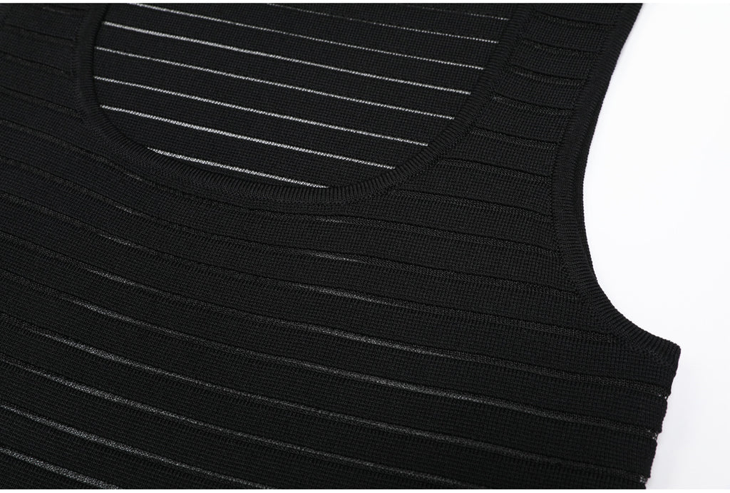 Upper bodice detail of black striped knit dress